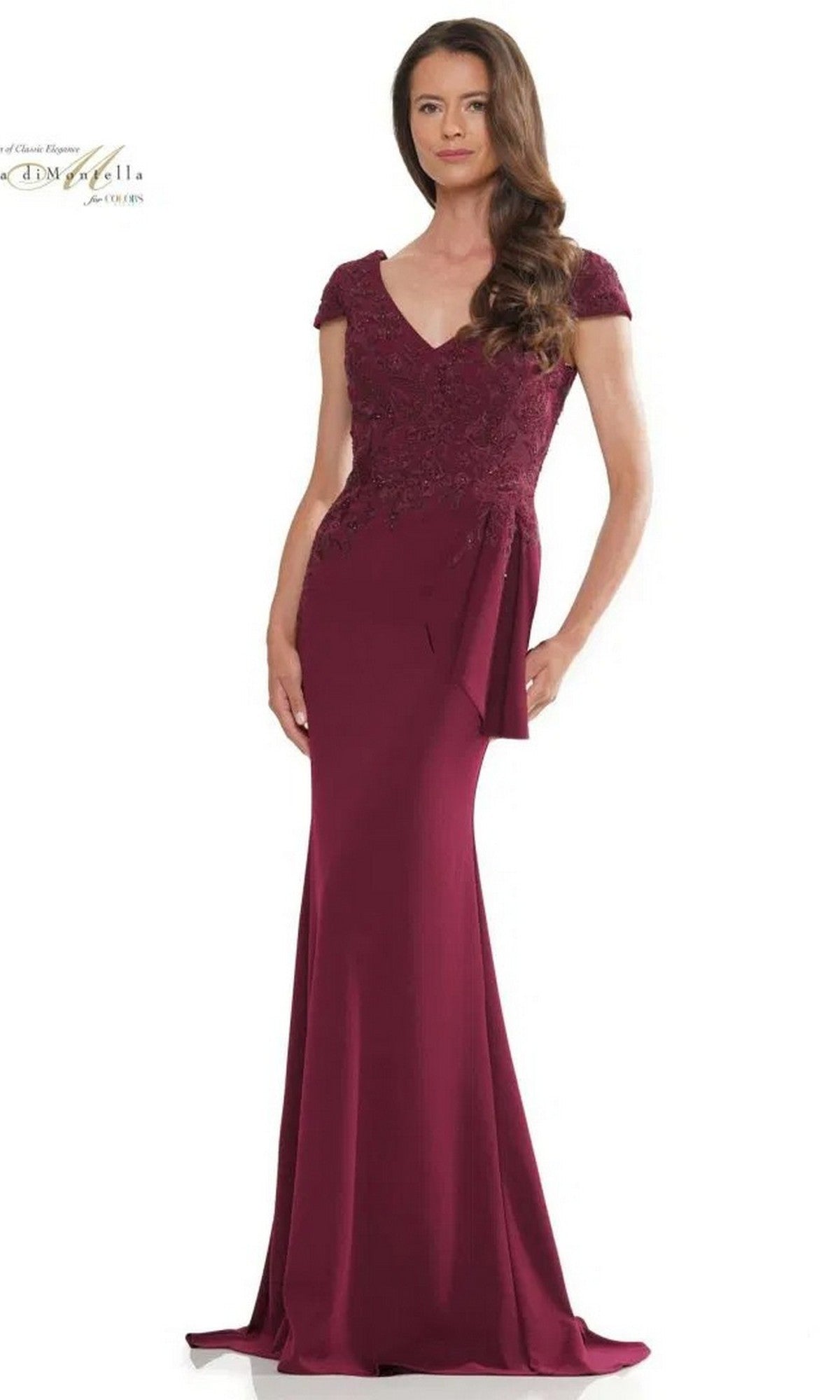 A woman wears the Rina Di Montella RD2960, a floor-length burgundy formal dress with short sleeves, an embroidered bodice, and a side sash, standing against a plain white background.